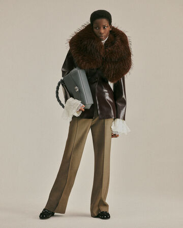 Model wearing brown fur collar coat from the Fall/Winter 2026 collection